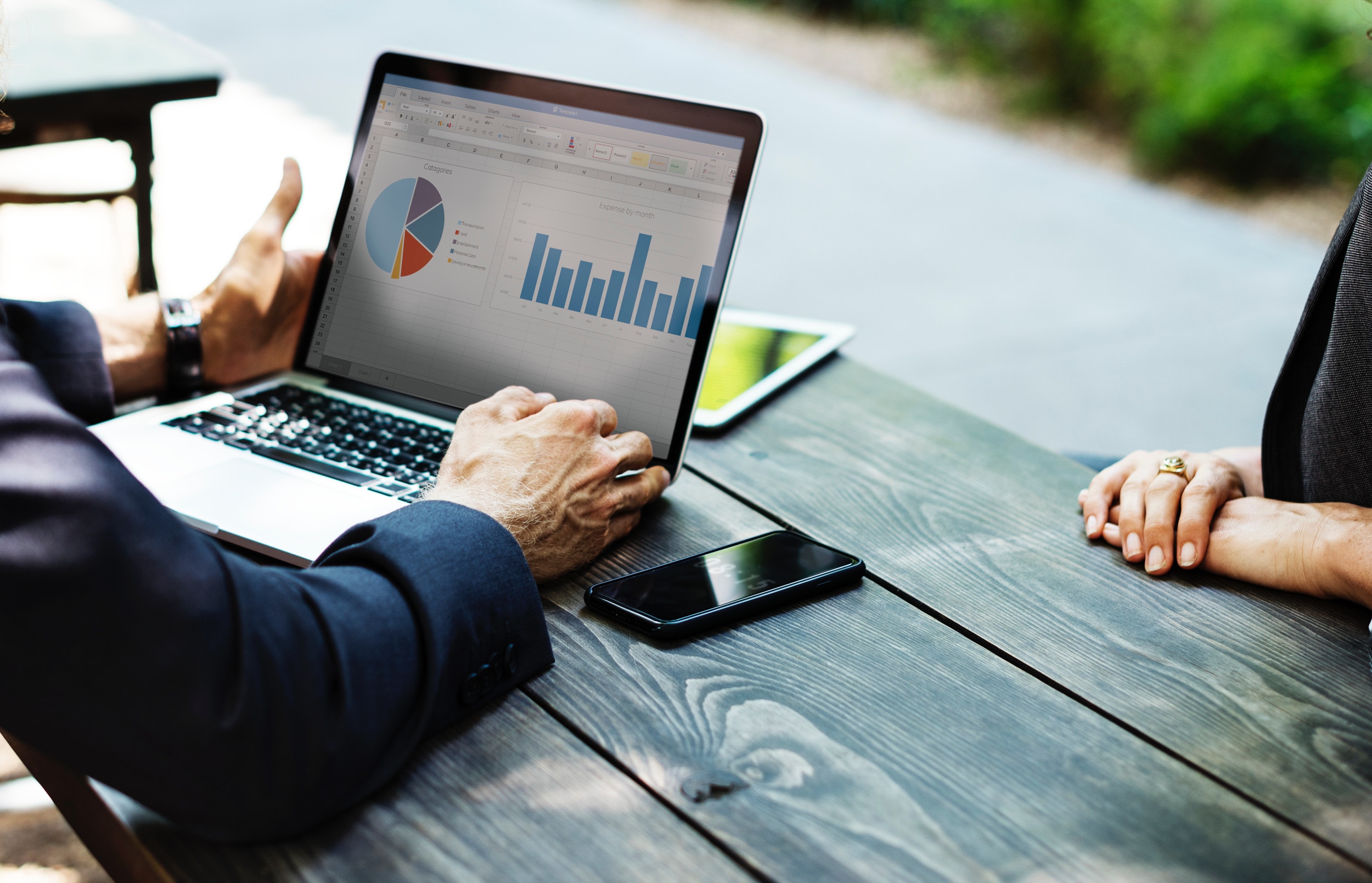 businessman accessing his mileage log template excel sheet