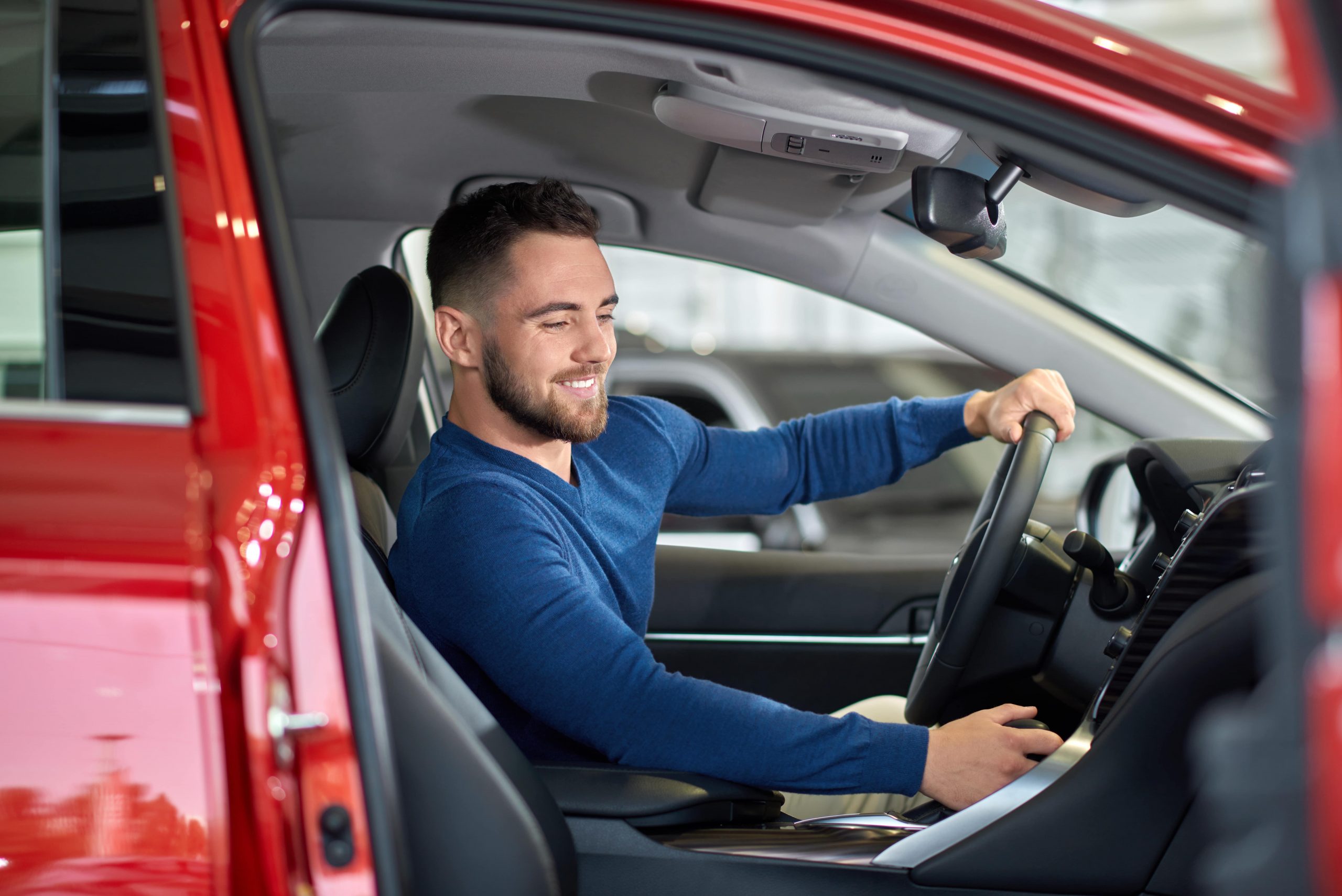 man trying new car with a mileage tracker app