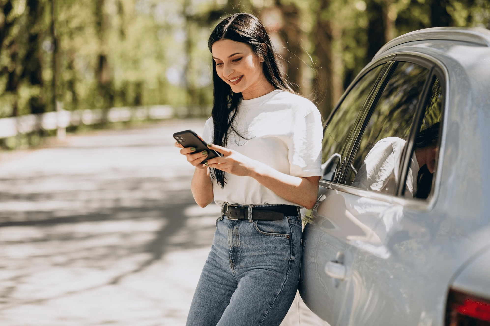 happy woman using an app to track mileage and expenses