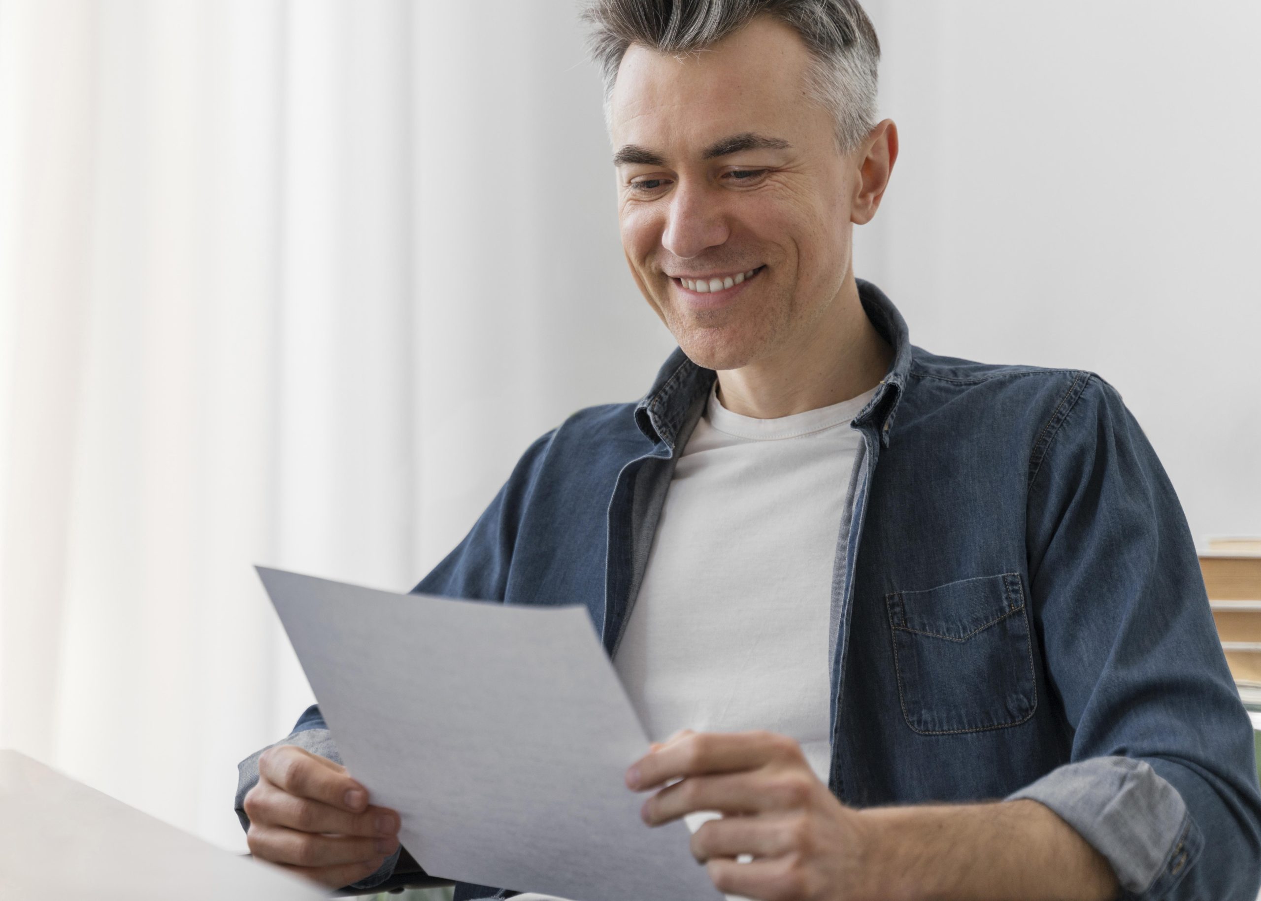 A satisfied man proudly showcasing his detailed MileageWise log, demonstrating the efficient tracking of his vehicle expenses