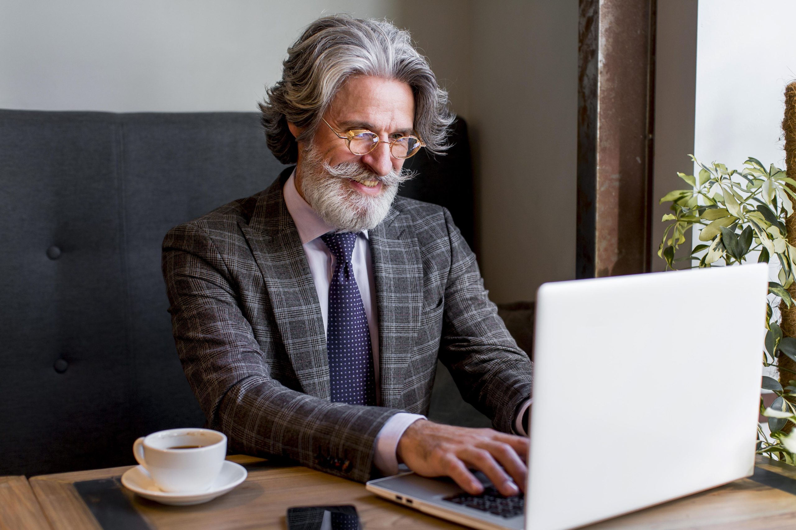 Entrepreneur confidently preparing to print their meticulously tracked small business mileage log from their computer, thanks to the ease and efficiency provided by MileageWise.