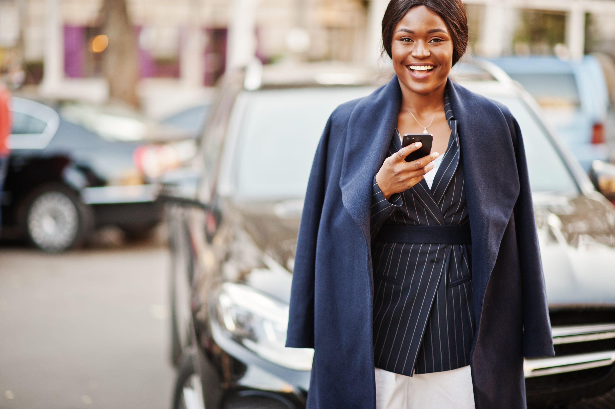 Entrepreneurial powerhouse takes control of her business expenses, confidently tracking her mileage using the intuitive MileageWise app on her smartphone.