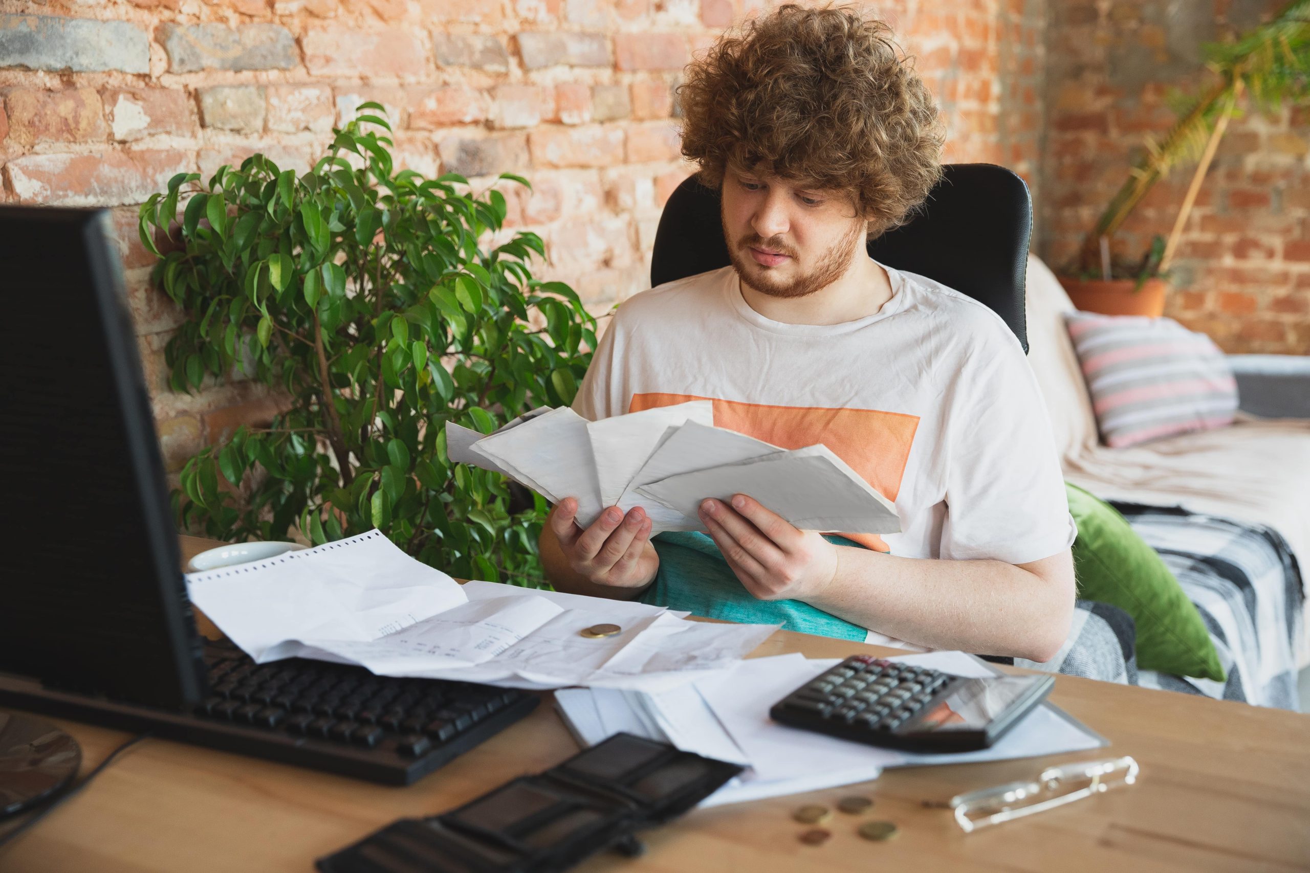 freelancer man prepares for 1099 tax calculations