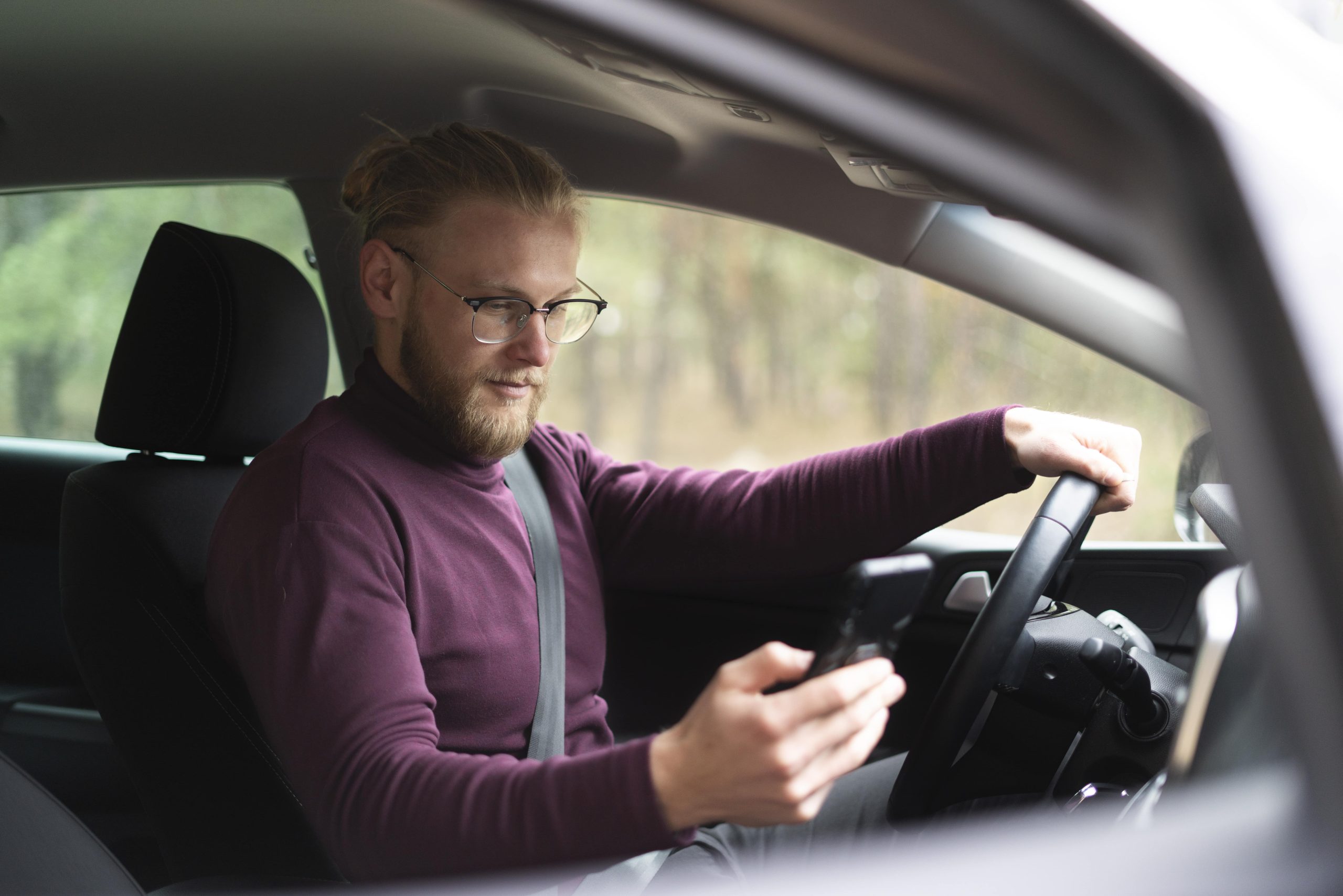 man tracks gas in the MileageWise App after refueling