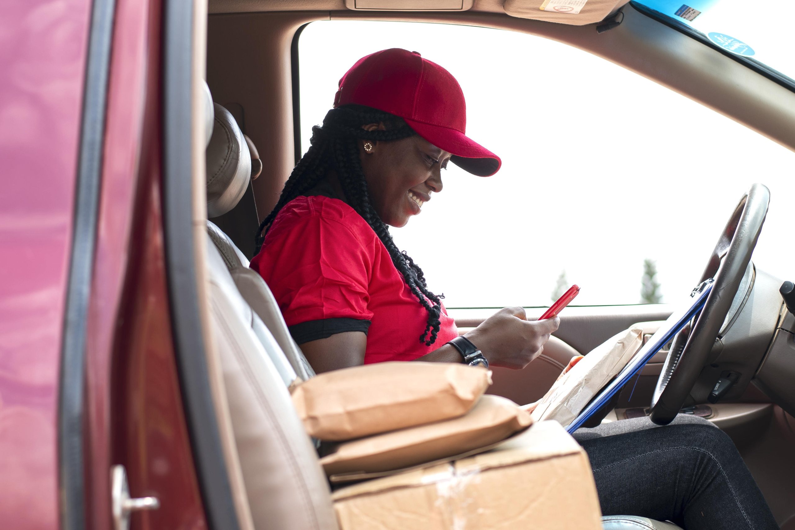 Woman uses the Roadie Driver App for deliveries while MileageWise records every mile in the background